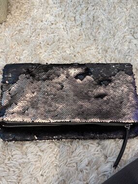 Sequined Reversible Clutch Bag in Black and metallic silver